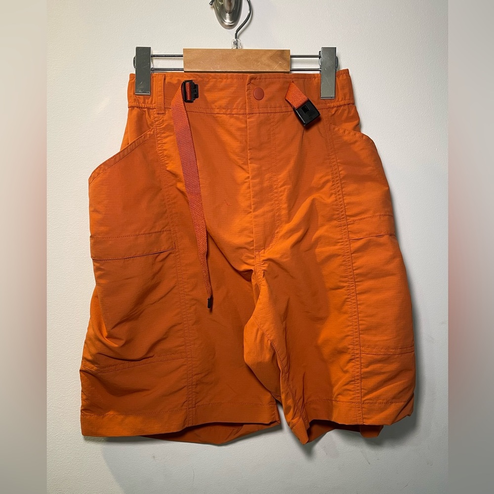Orange Uniqlo shorts with made in belt